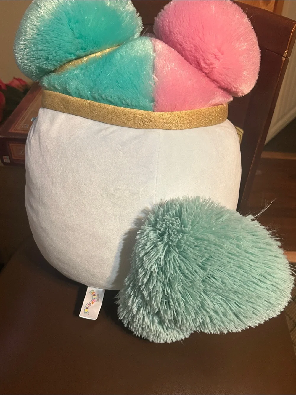 Squishmallows Plush Lyric SquirrPillow with Pink and Teal Pom Poms and Gold Trim
